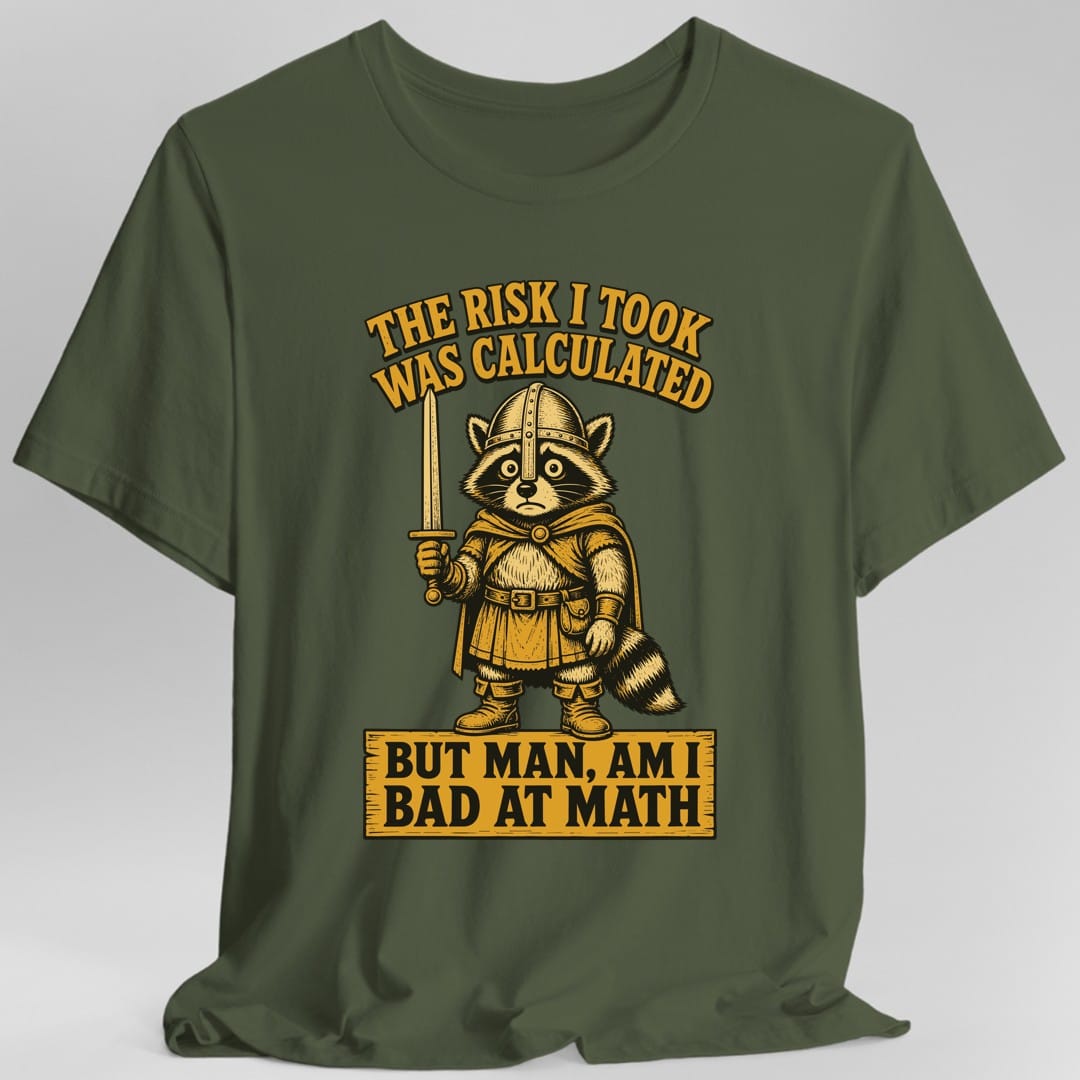 The same Risk Was Calculated raccoon design, on a military green t-shirt.