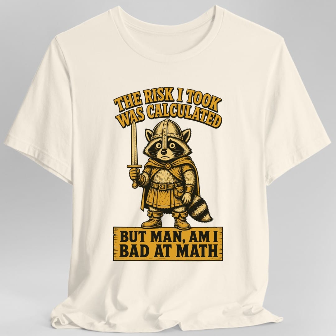 The same Risk Was Calculated raccoon design, on a natural t-shirt.