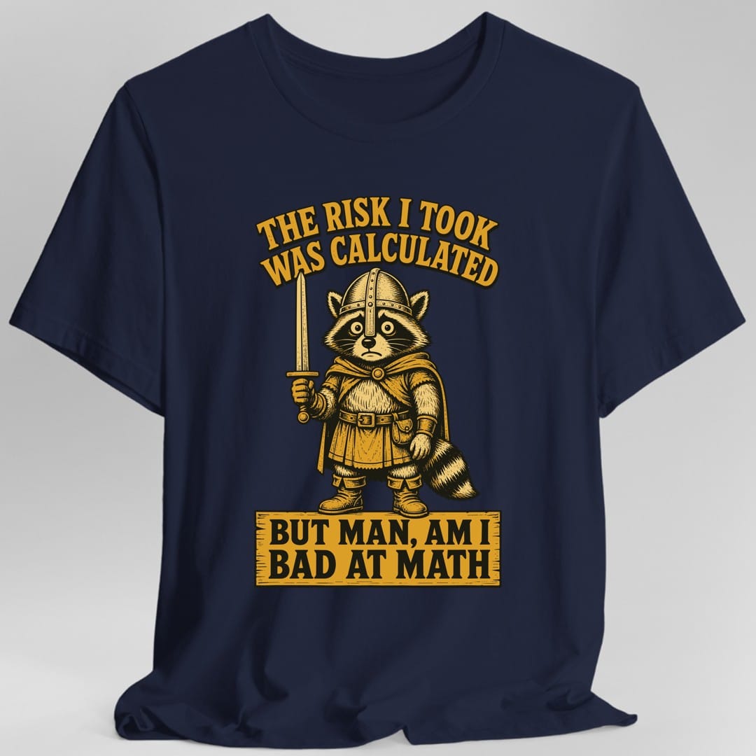 The same Risk Was Calculated raccoon design, on a navy t-shirt.