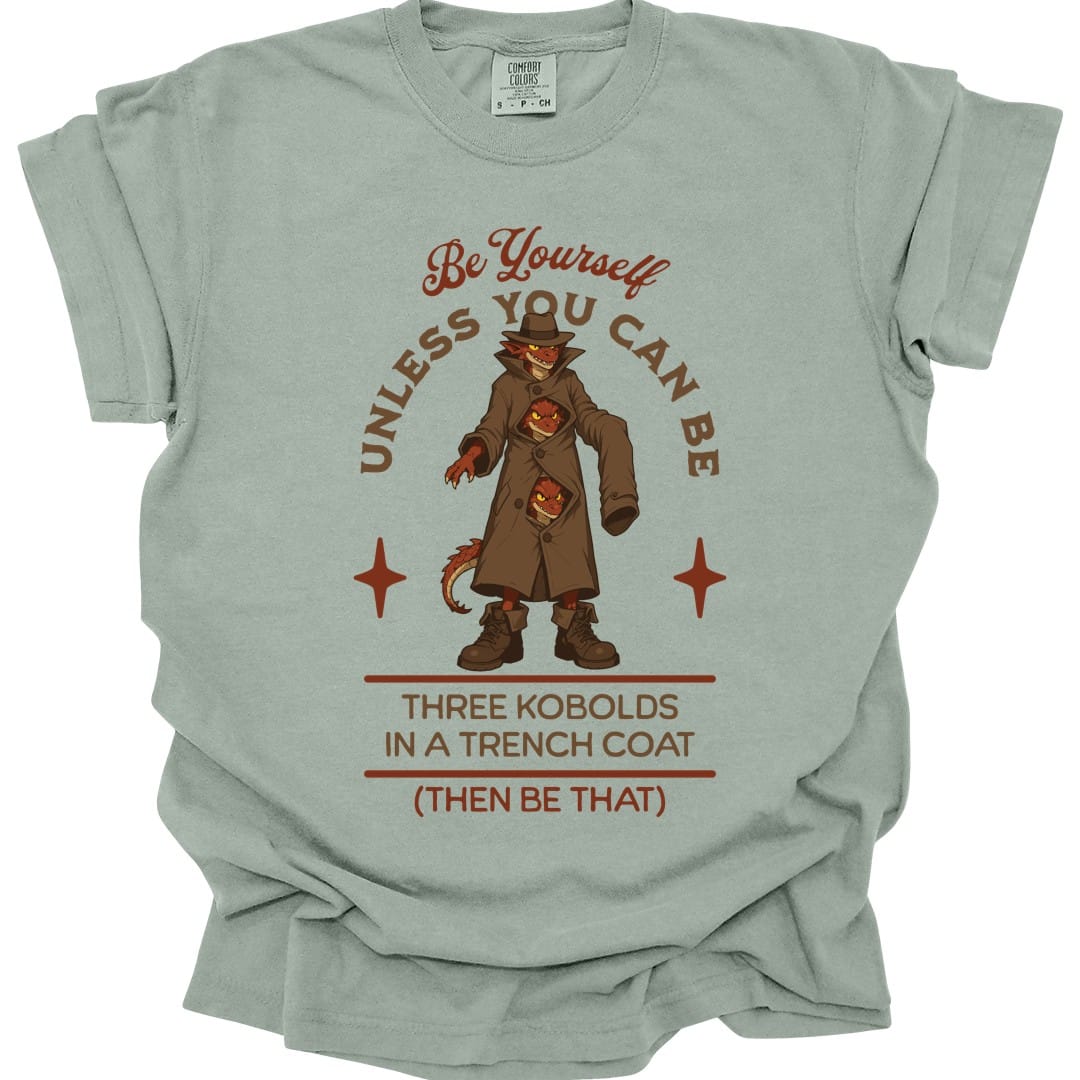 The same Three Kobolds in a Trench Coat design, on a bay t-shirt.