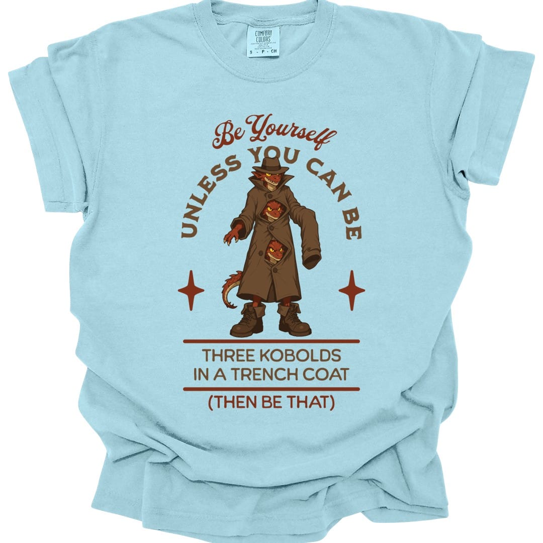 The same Three Kobolds in a Trench Coat design, on a chambray t-shirt.