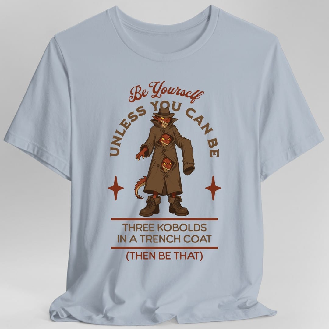 The same Three Kobolds in a Trench Coat design, on a light blue t-shirt.