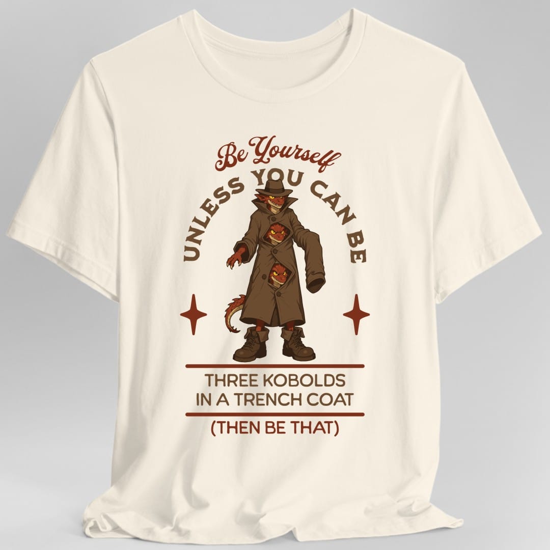 The same Three Kobolds in a Trench Coat design, on a natural t-shirt.
