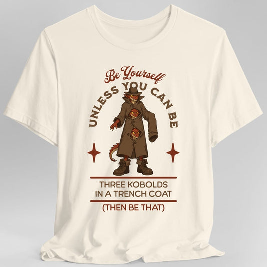 The same Three Kobolds in a Trench Coat design, on a natural t-shirt.