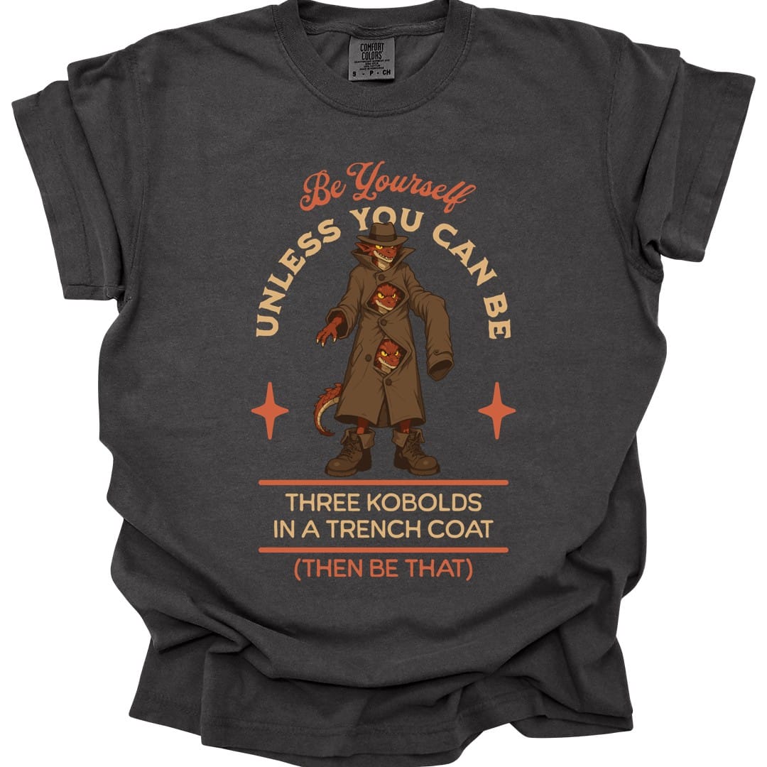 The same Three Kobolds in a Trench Coat design, on a pepper t-shirt.