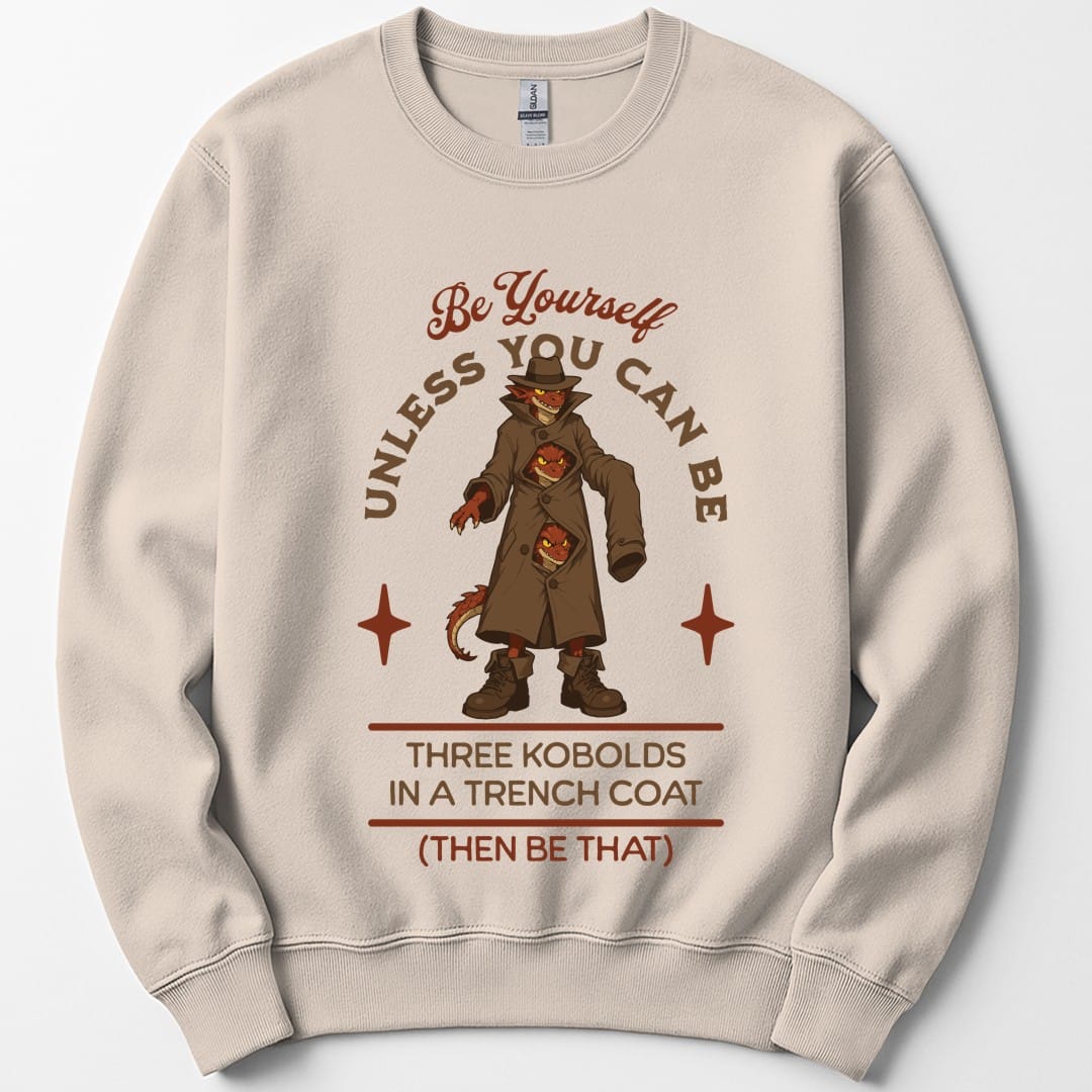The same Three Kobolds in a Trench Coat design, on a sand sweatshirt.