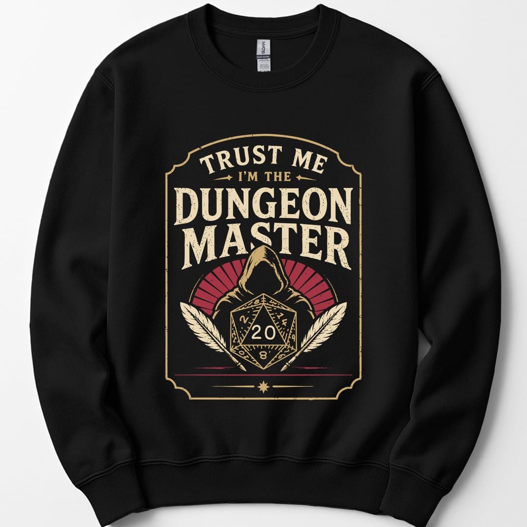 Black sweatshirt. A tall cream badge with a ruled border. "Trust me" sits at the top, then "Dungeon Master" in large capitals. Below, a hooded figure looms behind a twenty-sided die showing 20, flanked by two quill feathers, with a dark red fan behind the hood. Vintage badge style in cream and deep red.