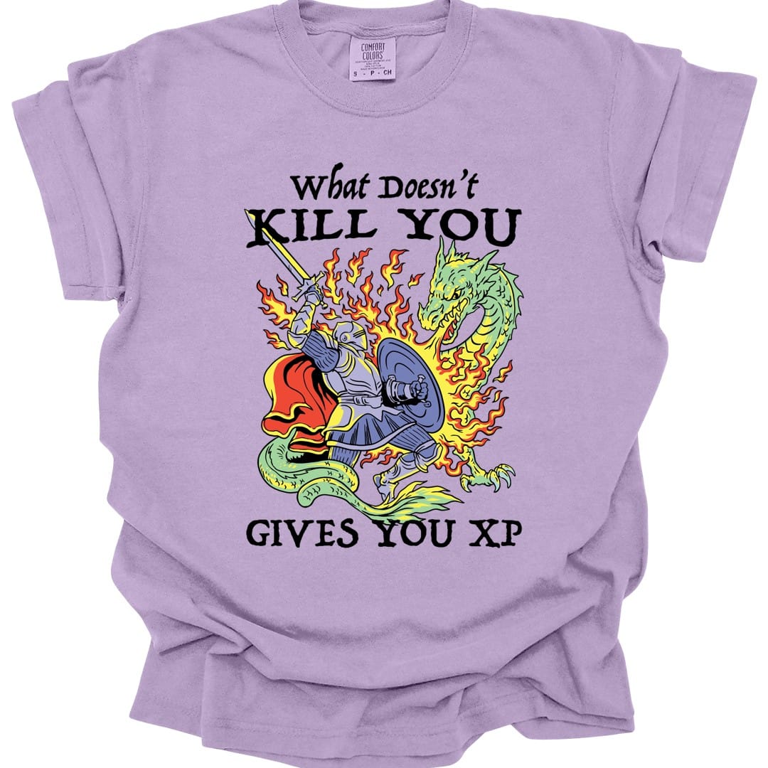 The same What Doesn't Kill You Gives You XP knight design, on an orchid t-shirt.