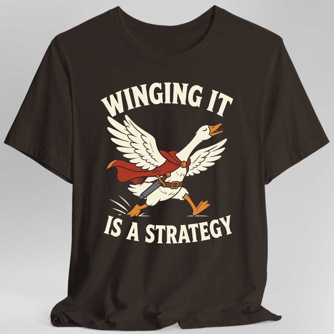 The same Winging It Is a Strategy design, on a dark chocolate t-shirt.