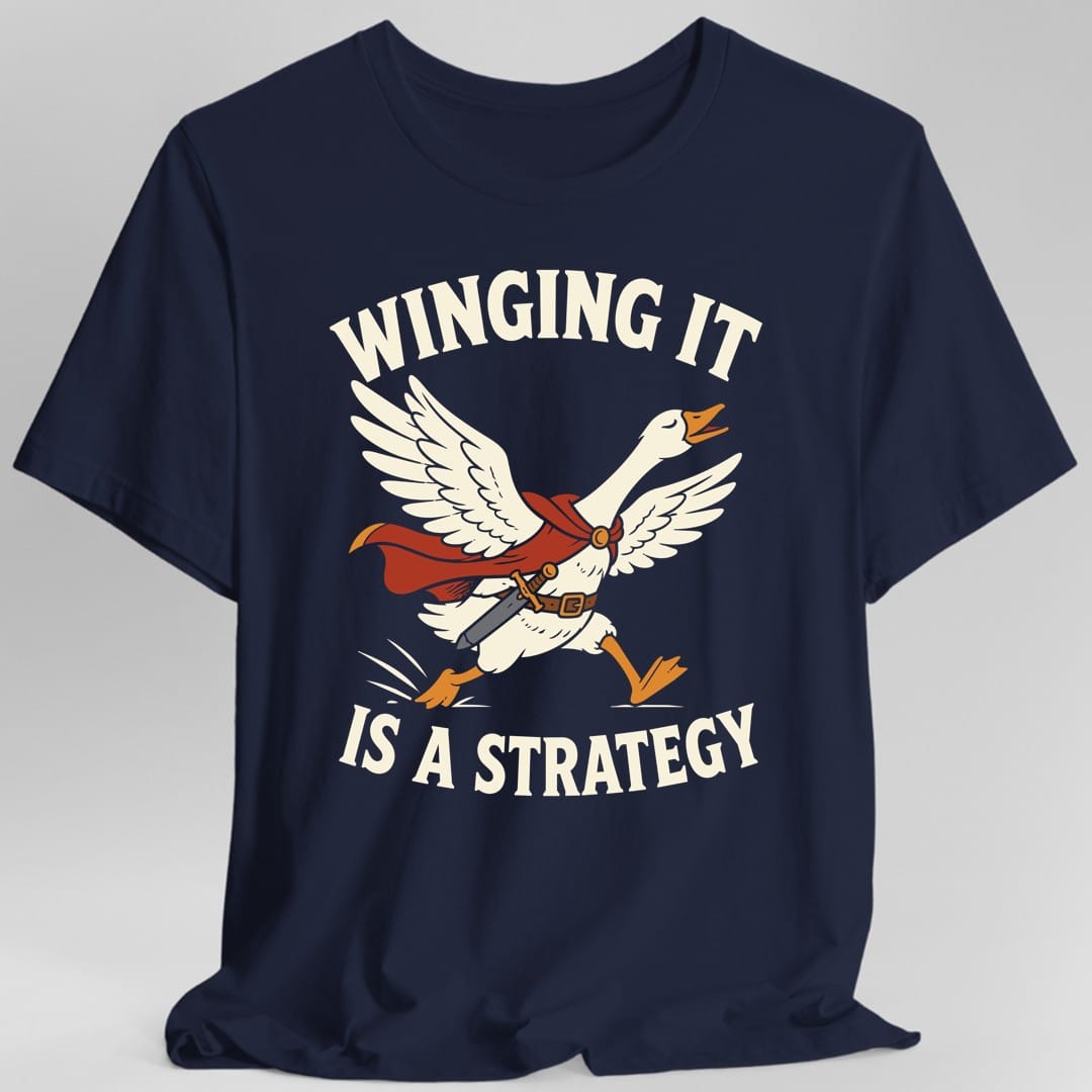 The same Winging It Is a Strategy design, on a navy t-shirt.