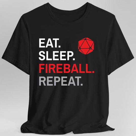 Black t-shirt. Four words stacked in heavy block capitals on four lines: "Eat." and "Sleep." in white, then "Fireball." in red, then "Repeat." in gray. A red twenty-sided die sits in the top right corner beside the word Eat. All type, no illustration.