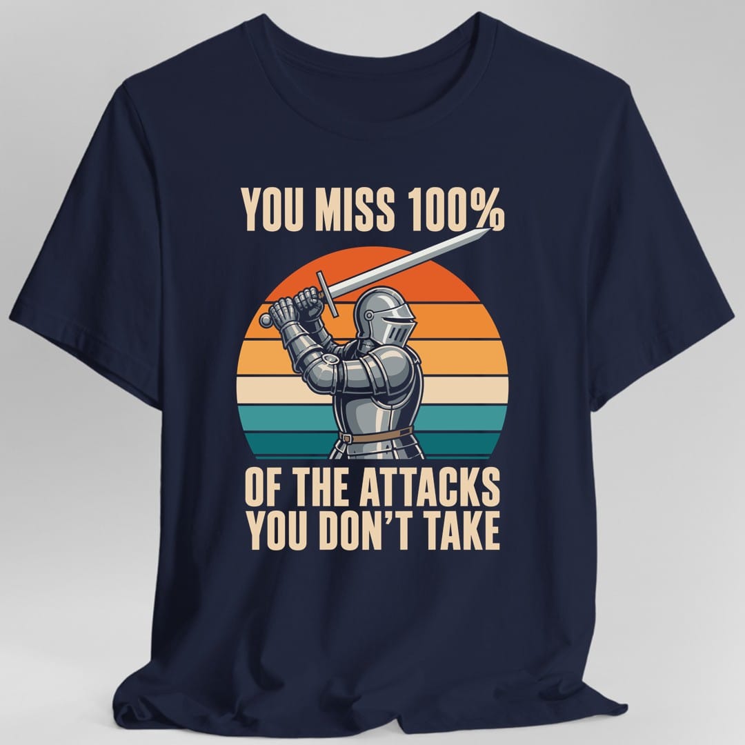 The same You miss 100% knight design, on a navy t-shirt.